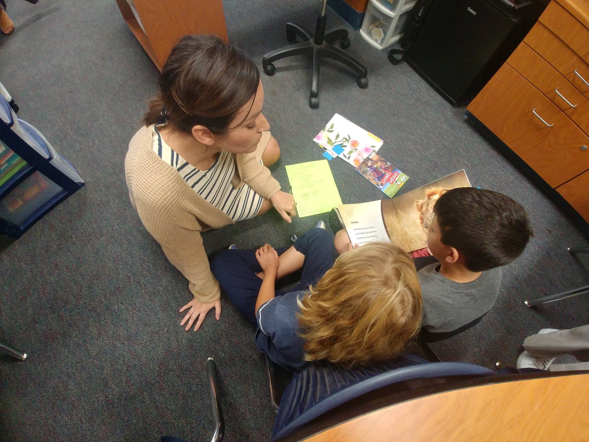 Photo of Lucia with students in a reading circle