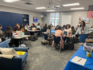 Lucia from Hola Books presenting a professional development workshop to a group of educators